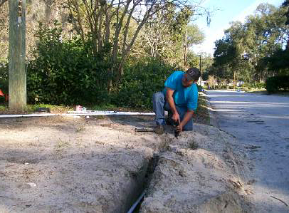 Santee Sprinkler Repair team memeber installs a new sprinkler system